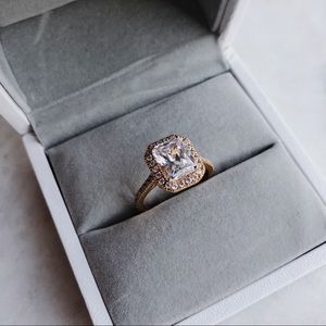 Emerald halo cocktail ring